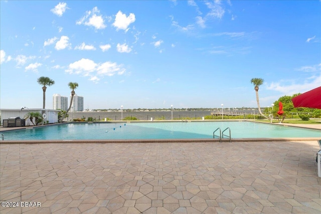 view of swimming pool with a patio