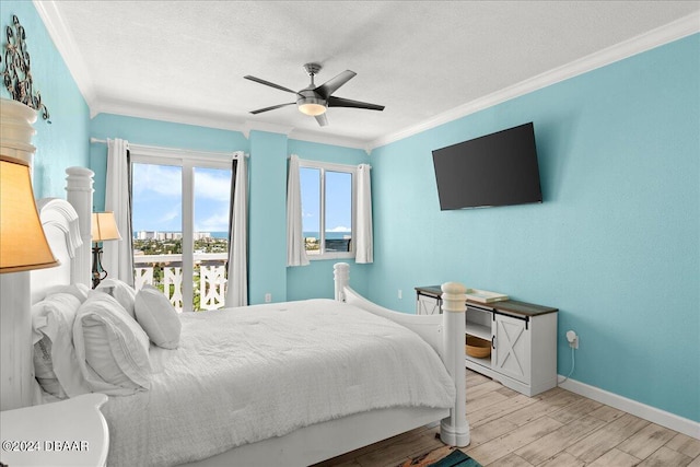 bedroom featuring crown molding, ceiling fan, a textured ceiling, and light wood-type flooring