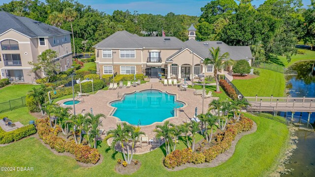 940 Village Trl Unit 3-203, Port Orange, FL 32127 - community pool with a patio area and a water view