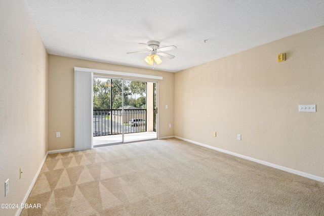 940 Village Trl Unit 3-203, Port Orange, FL 32127 - spare room featuring ceiling fan, light carpet, and baseboards