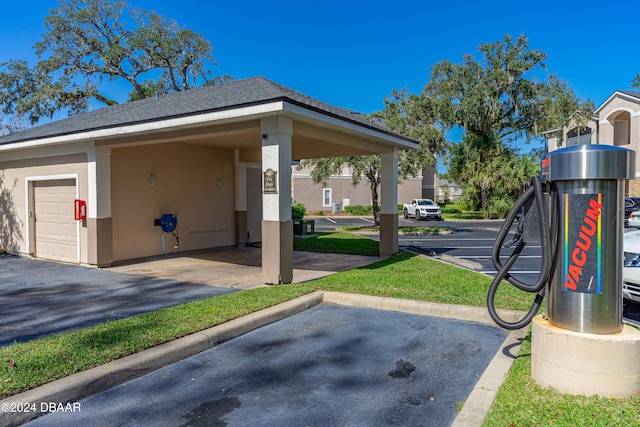 view of parking with a garage