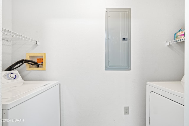 washroom with electric panel and separate washer and dryer