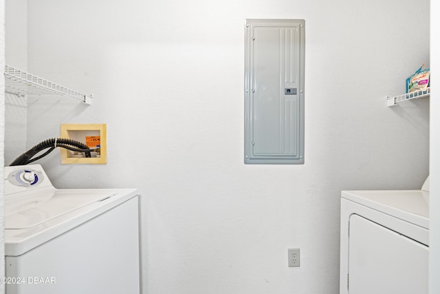 940 Village Trl Unit 3-203, Port Orange, FL 32127 - laundry room with electric panel and washer and dryer