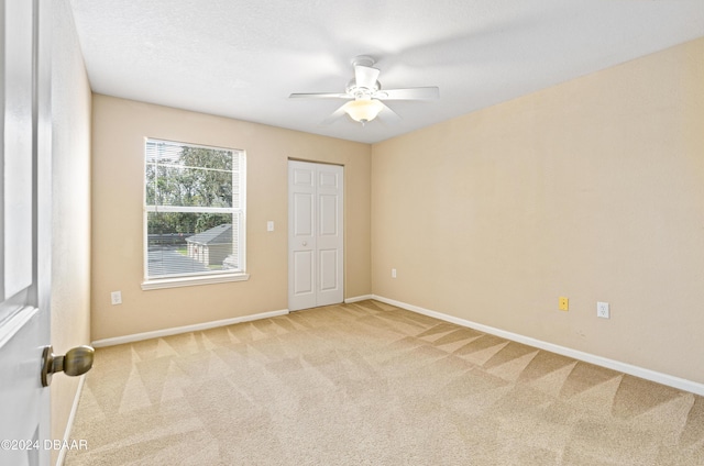 940 Village Trl Unit 3-203, Port Orange, FL 32127 - spare room featuring carpet flooring, baseboards, and ceiling fan
