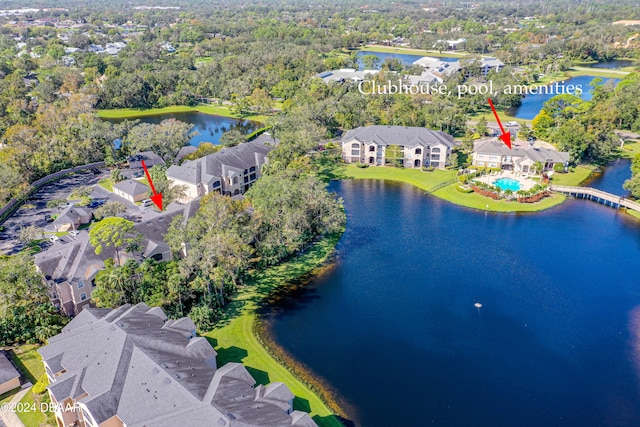 birds eye view of property with a water view