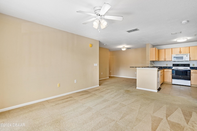 kitchen with kitchen peninsula, light carpet, ceiling fan, light brown cabinets, and white appliances