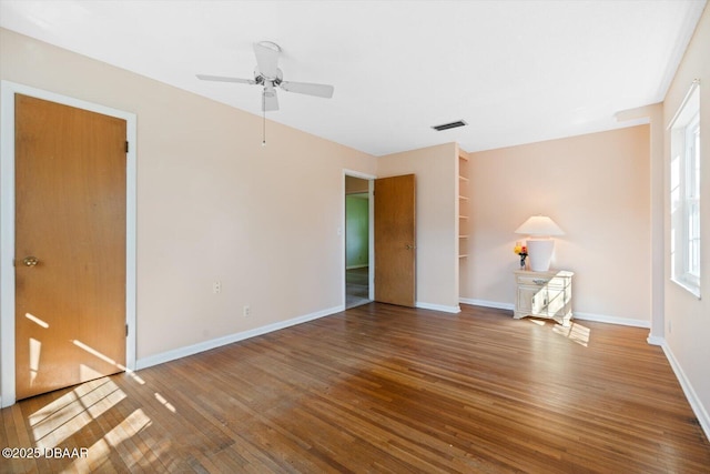 unfurnished living room with hardwood / wood-style flooring and ceiling fan