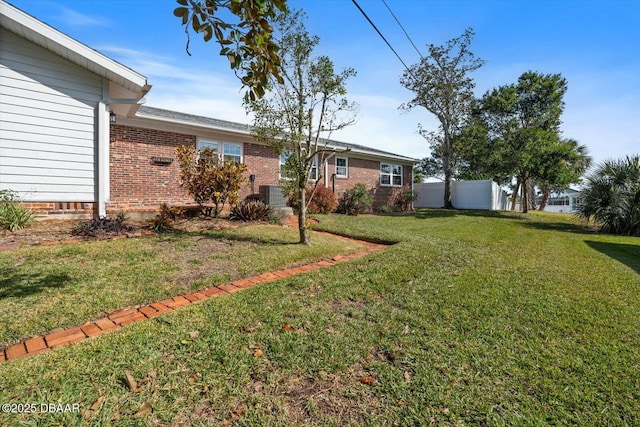 view of yard featuring central AC unit