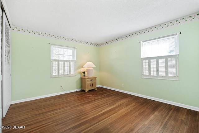 empty room featuring hardwood / wood-style floors