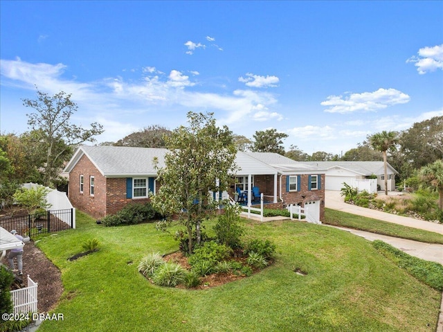 view of front of home with a garage, a porch, and a front yard