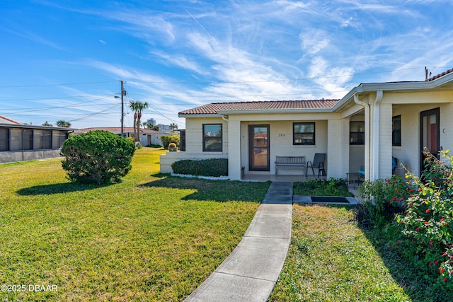 bungalow-style home with a front yard