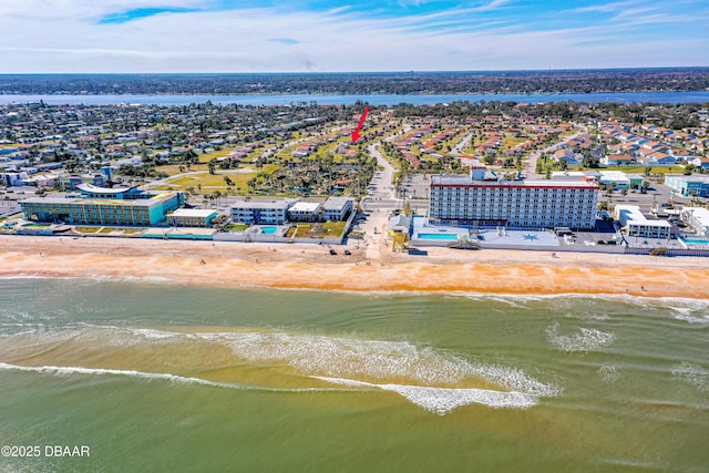 aerial view with a water view and a beach view