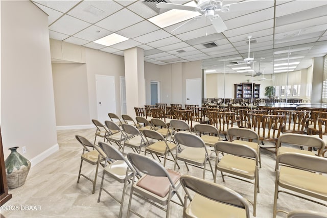 dining space featuring a paneled ceiling and ceiling fan