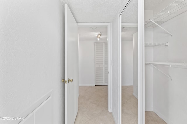 walk in closet featuring light tile patterned floors