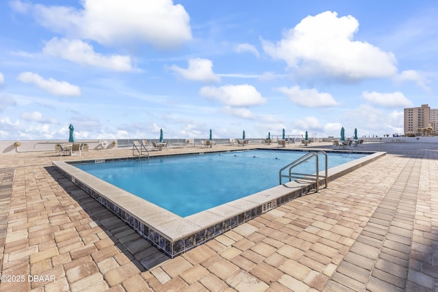 view of pool featuring a patio