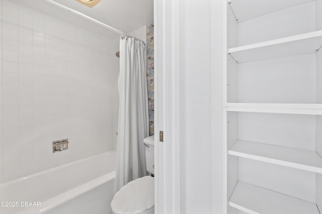 bathroom featuring toilet and shower / bath combo with shower curtain