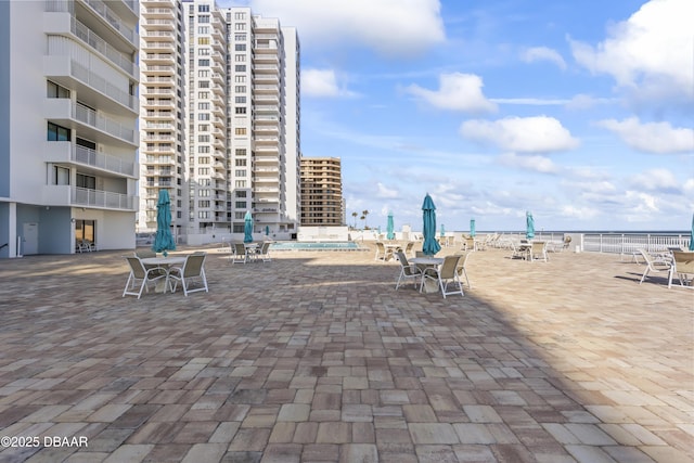 view of home's community featuring a patio area