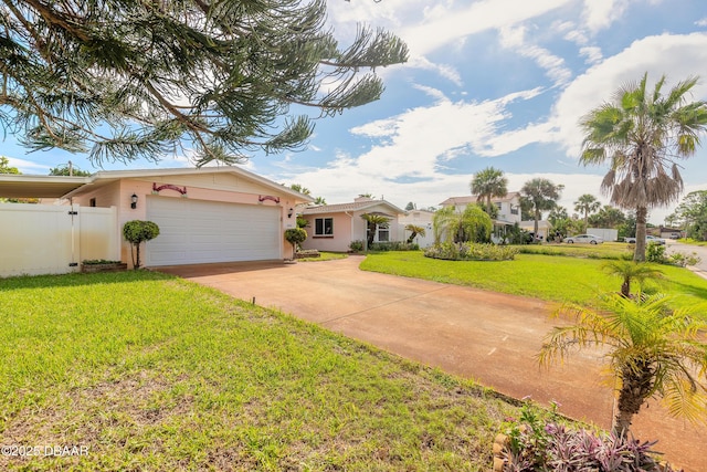 ranch-style house featuring a garage and a front lawn