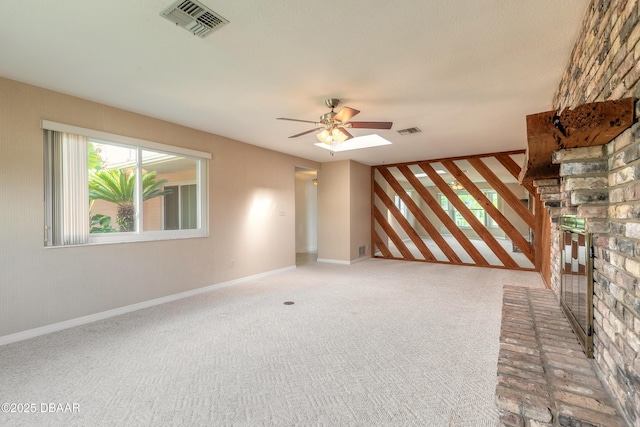 unfurnished living room featuring carpet flooring and ceiling fan