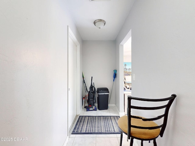 hallway featuring light tile patterned floors