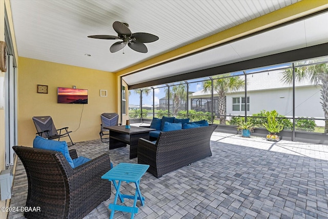 sunroom with a wealth of natural light and ceiling fan