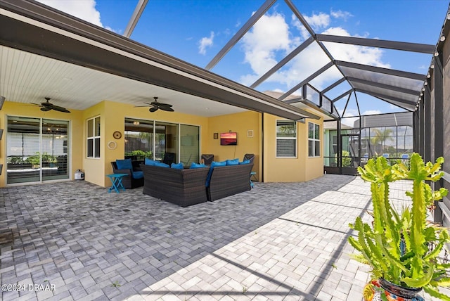 view of patio with glass enclosure, an outdoor living space, and ceiling fan