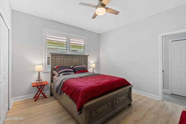 bedroom featuring a closet, ceiling fan, and light hardwood / wood-style floors