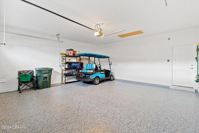 garage featuring a garage door opener