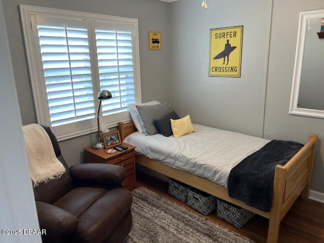 bedroom with wood finished floors