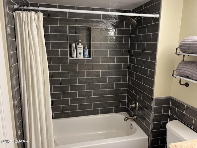 bathroom with shower / bath combination with curtain and toilet