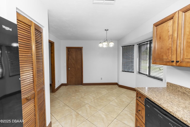 909 Brookside Dr, Ormond Beach, FL 32174 - kitchen with dishwasher, a chandelier, light tile patterned floors, and baseboards