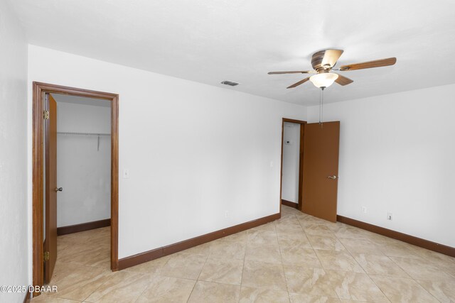 909 Brookside Dr, Ormond Beach, FL 32174 - empty room featuring a ceiling fan and baseboards