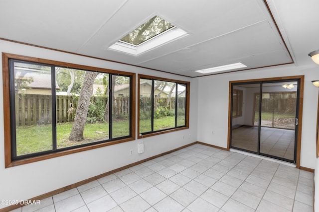 909 Brookside Dr, Ormond Beach, FL 32174 - unfurnished room featuring baseboards and a skylight