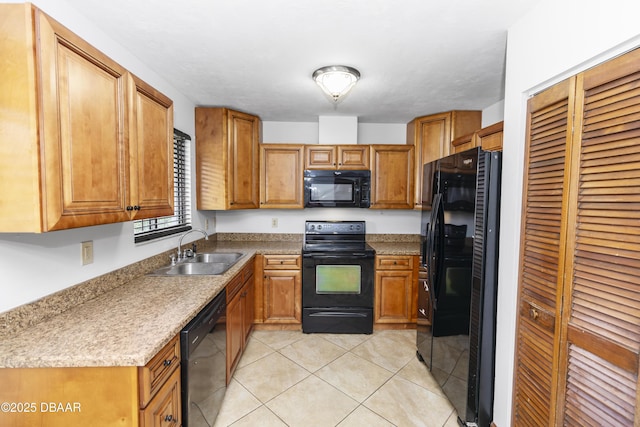 909 Brookside Dr, Ormond Beach, FL 32174 - kitchen featuring black appliances, a sink, and brown cabinetry