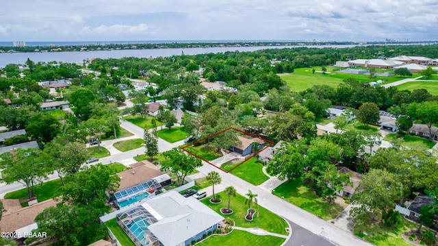 909 Brookside Dr, Ormond Beach, FL 32174 - aerial view of residential area featuring property parcel outlined and a large body of water