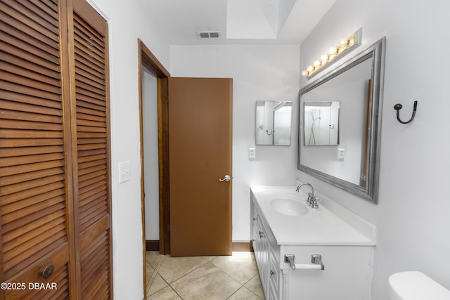 909 Brookside Dr, Ormond Beach, FL 32174 - bathroom featuring vanity, toilet, a closet, and tile patterned floors