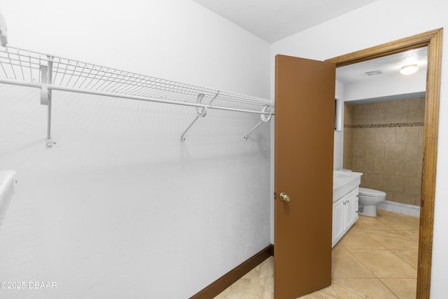 909 Brookside Dr, Ormond Beach, FL 32174 - spacious closet with light tile patterned flooring