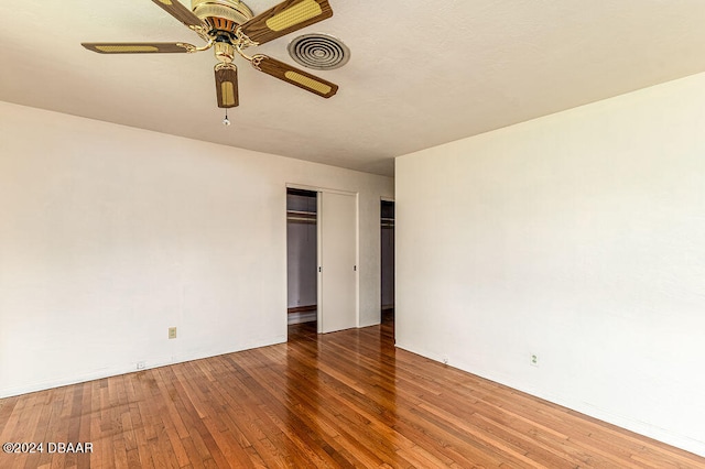 unfurnished room featuring hardwood / wood-style flooring and ceiling fan