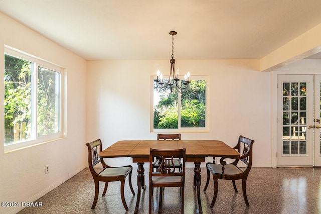 dining room with a notable chandelier