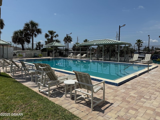 3800 S Atlantic Ave Unit 2010, Daytona Beach Shores, FL 32118 - community pool with a gazebo, fence, and a patio area