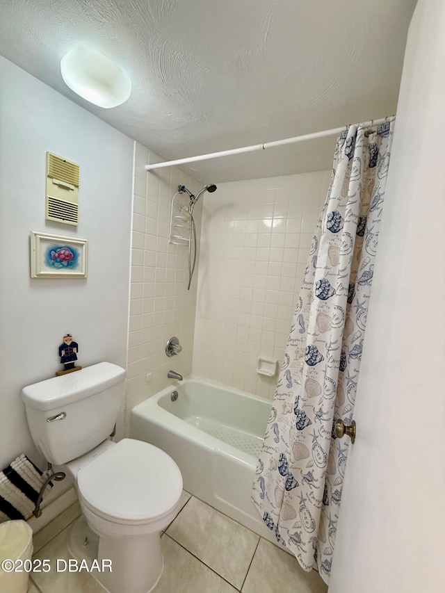 3800 S Atlantic Ave Unit 2010, Daytona Beach Shores, FL 32118 - full bathroom featuring tile patterned floors, shower / tub combo, toilet, and a textured ceiling