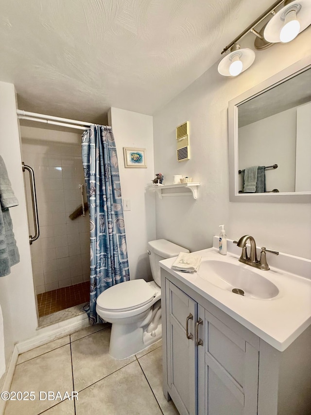 3800 S Atlantic Ave Unit 2010, Daytona Beach Shores, FL 32118 - bathroom with a shower stall, tile patterned flooring, toilet, and vanity