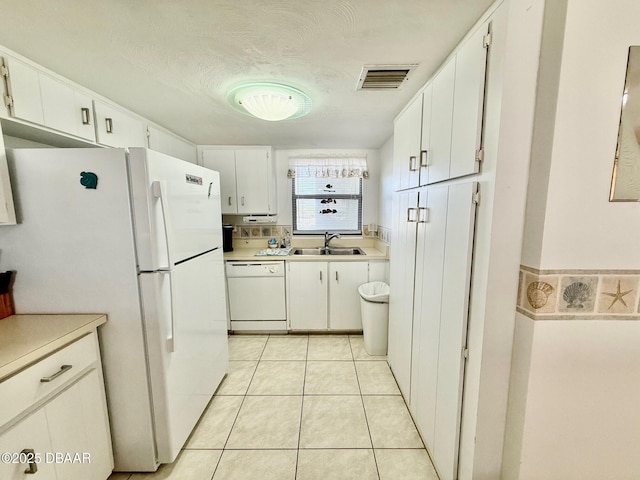 3800 S Atlantic Ave Unit 2010, Daytona Beach Shores, FL 32118 - kitchen featuring white appliances, a sink, light countertops, and white cabinets