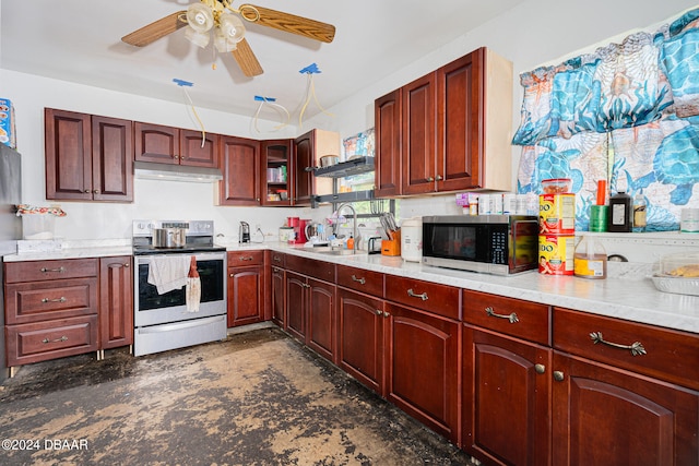 kitchen featuring stainless steel appliances, sink, and ceiling fan