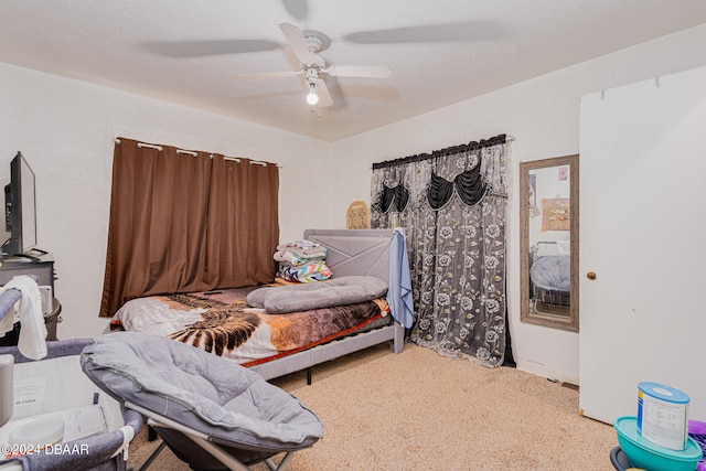 bedroom featuring ceiling fan and carpet flooring