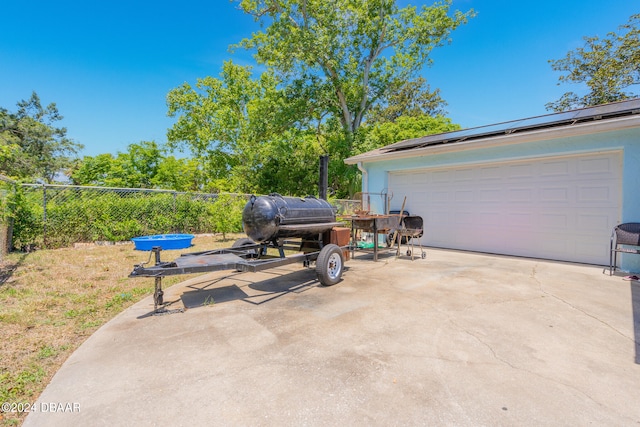 view of patio / terrace with a garage