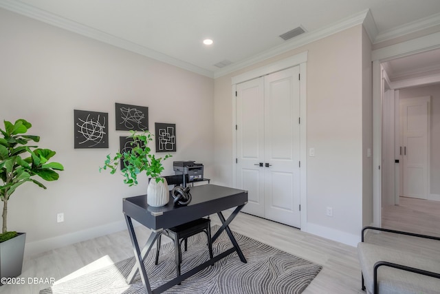 office area with crown molding and light wood-type flooring