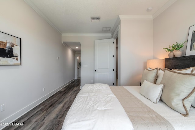 bedroom featuring crown molding and dark hardwood / wood-style flooring