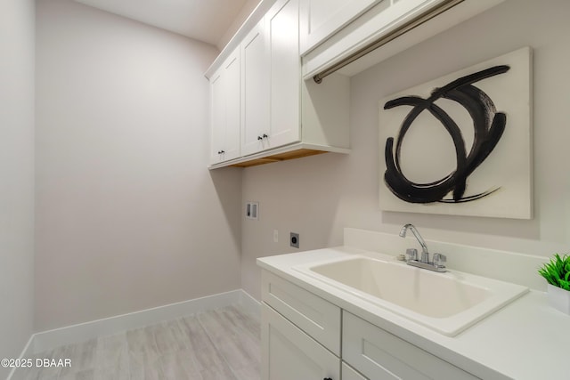 laundry area with cabinets, sink, electric dryer hookup, and hookup for a washing machine