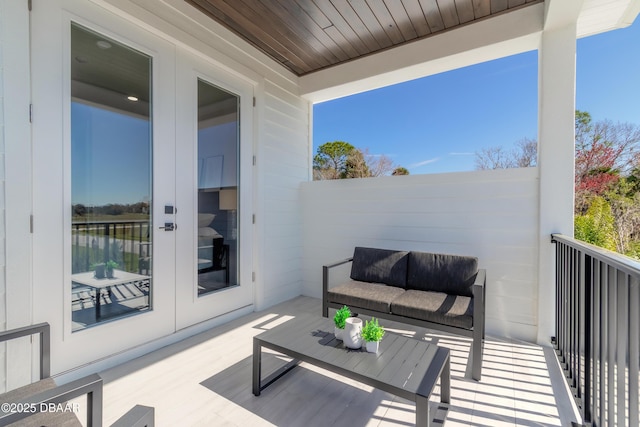 balcony featuring french doors